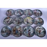 A SET OF TWELVE CHINESE PORCELAIN PLATES 20th Century, decorated with figures in various pursuits. 1