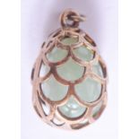 A CONTINENTAL SILVER AND JADE EGG PENDANT. 5.8 grams. 1.5 cm x 1 cm.
