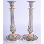 A FINE PAIR OF 19TH CENTURY FRENCH SILVER PLATED CANDLESTICKS overlaid in acanthus. 29 cm high.