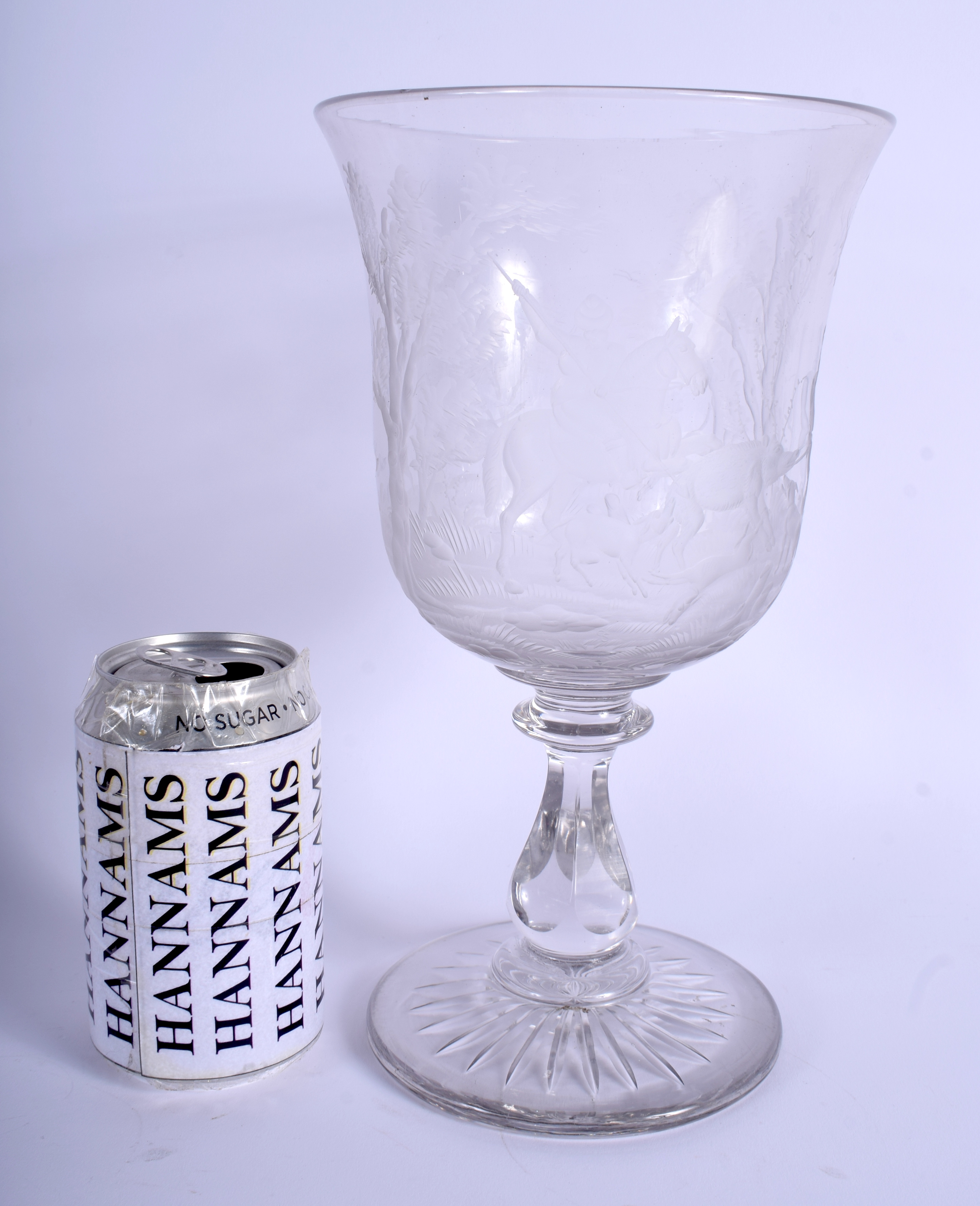 A GOOD LARGE ANTIQUE CRYSTAL GLASS GOBLET engraved with hunting scenes. 27 cm high.
