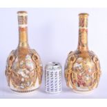 A LARGE PAIR OF 19TH CENTURY JAPANESE MEIJI PERIOD SATSUMA BOTTLE VASES AND COVERS painted with figu