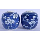 A PAIR OF 19TH CENTURY CHINESE BLUE AND WHITE GINGER JARS Kangxi style, painted with prunus. 14 cm x