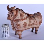 A LARGE EARLY INDUS VALLEY POTTERY FIGURE OF A STANDING COW modelled boldly standing decorated with