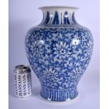 A LARGE 19TH CENTURY KOREAN BLUE AND WHITE VASE painted with stylised flowers. 33 cm x 16 cm.