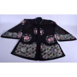 AN EARLY 20TH CENTURY CHINESE BLACK SILK WORK EMBROIDERED JACKET decorated with roundels. 98 cm x 60