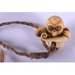 A 19TH CENTURY JAPANESE MEIJI PERIOD CARVED IVORY NETSUKE in the form of an octopus. 1 cm wide.