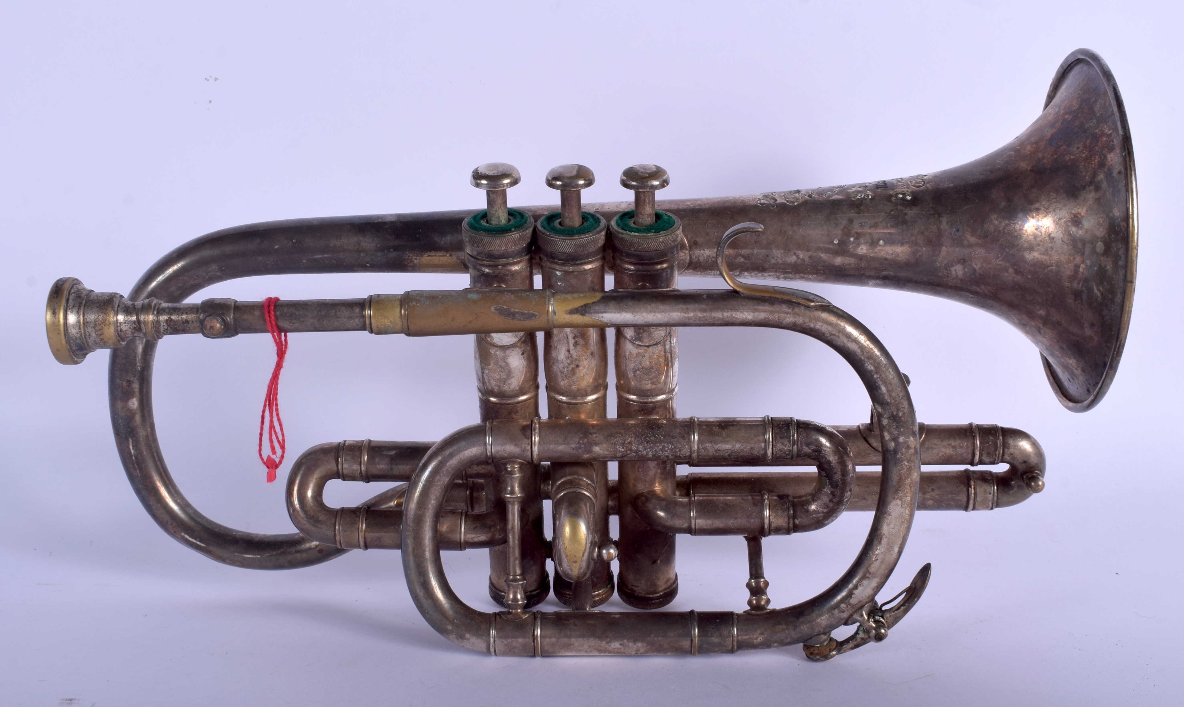 A VINTAGE HIGHLAND CLEAR BORE CORNET MUSICAL INSTRUMENT Class A, Soloist. 33 cm x 20 cm.