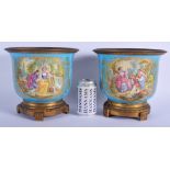 A FINE LARGE PAIR OF 19TH CENTURY SEVRES PORCELAIN CACHE POTS painted with lovers within a landscape
