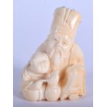 A 19TH CENTURY JAPANESE MEIJI PERIOD CARVED IVORY NETSUKE modelled as a father and child. 5.5 cm x 3