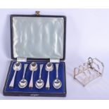 SIX SILVER TEASPOONS and a silver toast rack. Sheffield 1944 & Birmingham 1933. 130 grams. (7)