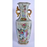 A 19TH CENTURY CHINESE CANTON CELADON FAMILLE ROSE VASE Qing, painted with low tables and foliage. 3