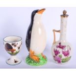 A SCOTTISH WEMYSS TYPE G HILL POTTERY EGG CUP together with a penguin etc. Largest 13.5 cm high. (3)