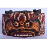 A TIBETAN PAINTED WOOD MASK HEAD BELL. 24 cm x 12 cm.