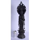 A VERY LARGE CHINESE IRON FIGURE OF A STANDING BUDDHISTIC DEITY modelled upon a lotus throne. 58 cm