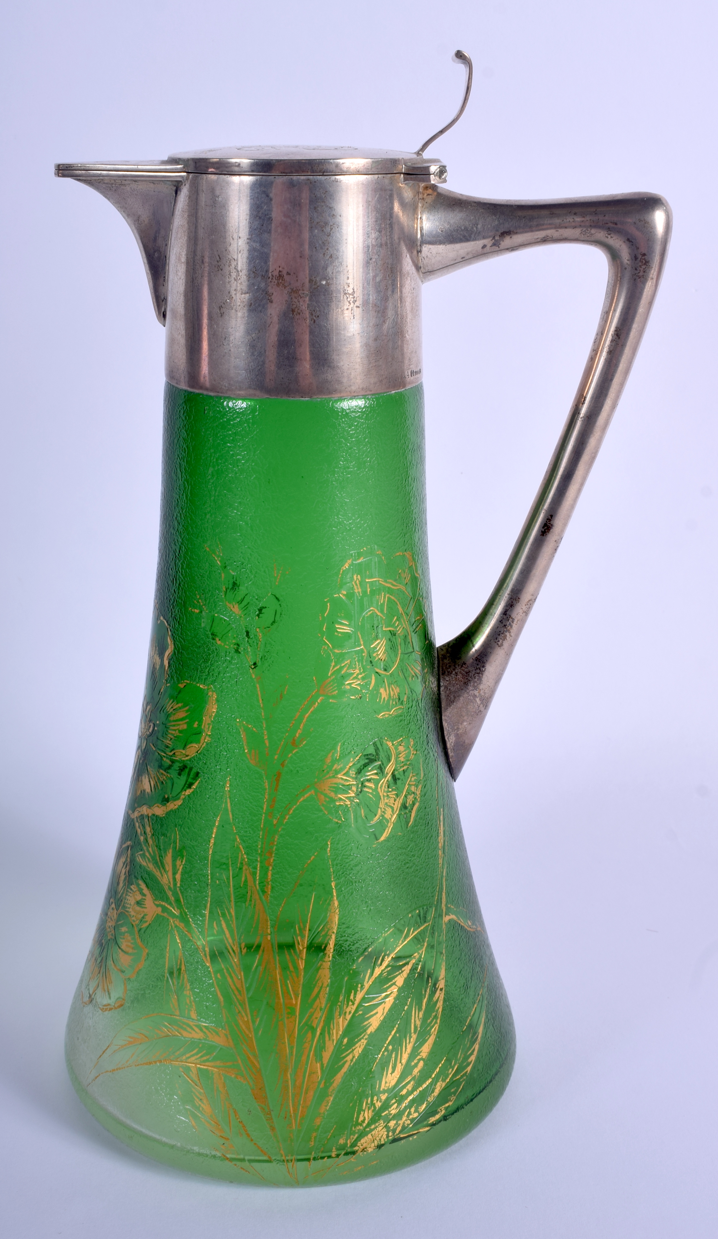 A LARGE ART NOUVEAU SILVER MOUNTED GREEN GLASS CLARET JUG painted with gilt flowers. 28 cm high.