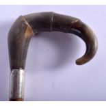 A 19TH CENTURY CONTINENTAL CARVED RHINOCEROS HORN HANDLED WALKING STICK. 85 cm long.