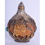 AN EARLY 20TH CENTURY TIBETAN SILVER OVERLAID SNUFF BOTTLE AND STOPPER decorated with birds and foli