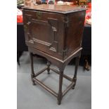 A 17TH/18TH CENTURY OAK SPICE CUPBOARD ON STAND with geometric decoration. 103 cm x 51 cm.