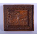 AN 18TH CENTURY CONTINENTAL FRUITWOOD CARVED TREEN PANEL depicting two lovers within a rural landsca