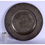 A VERY LARGE 17TH/18TH CENTURY ENGLISH BROAD RIM PEWTER CHARGER with proof marks and wriggle work mo
