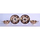 Royal Crown Derby pair of pedestal teacups and saucers painted with imari pattern 9022