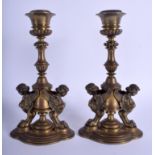 A PAIR OF 19TH CENTURY FRENCH BRONZE CANDLESTICKS with caryatid winged supports. 23 cm high.