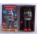 A BOXED BATTERY OPERATED THUNDER ROBOT. 24 cm high.