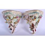 A PAIR OF 19TH CENTURY AUSTRIAN VIENNA PORCELAIN WALL BRACKETS painted with figures and landscapes.