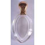 AN ANTIQUE 18CT GOLD MOUNTED GLASS SCENT BOTTLE. 9.5 cm high.