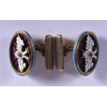A PAIR OF CONTINENTAL SILVER GILT AND ENAMEL EAGLE CUFFLINKS. 21 grams.