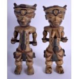 A PAIR OF EARLY 20TH CENTURY AFRICAN PAINTED TRIBAL FIGURES painted with motifs. 25 cm x 8 cm.