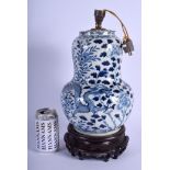 A 19TH CENTURY CHINESE BLUE AND WHITE BULBOUS DRAGON VASE converted to a lamp, painted with foliage