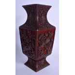 AN EARLY 20TH CENTURY CHINESE CARVED CINNABAR LACQUER VASE Qing, decorated with flowers. 24 cm high.