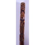 A VERY UNUSUAL 19TH CENTURY CONTINENTAL TRIBAL CARVED WOOD CANE possibly South American, overlaid wi
