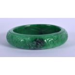 A CHINESE GREEN JADE BANGLE 20th Century. 7.25 cm diameter.