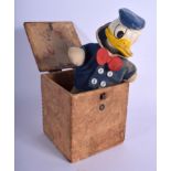A VINTAGE DONALD DUCK JACK IN THE BOX TOY. 12 cm x 8 cm closed.