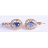 A PAIR OF 14CT GOLD DIAMOND AND SAPPHIRE EARRINGS. 6.2 grams. 1.8 cm long.