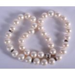 A PEARL AND DIAMOND NECKLACE. 68 grams. 42 cm long.