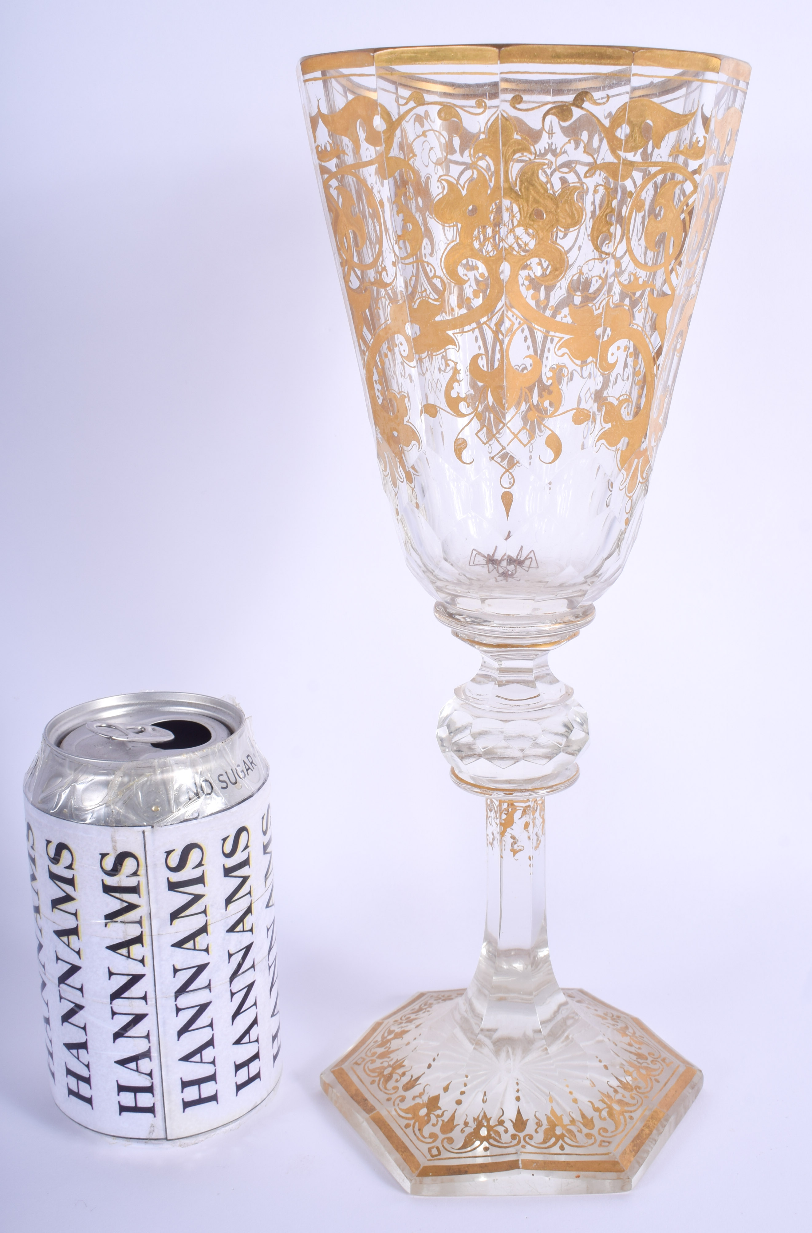 A LARGE 19TH CENTURY BOHEMIAN GILT DECORATED GLASS GOBLET highlighted with scrolling vines. 28.5 cm