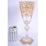 A LARGE 19TH CENTURY BOHEMIAN GILT DECORATED GLASS GOBLET highlighted with scrolling vines. 28.5 cm