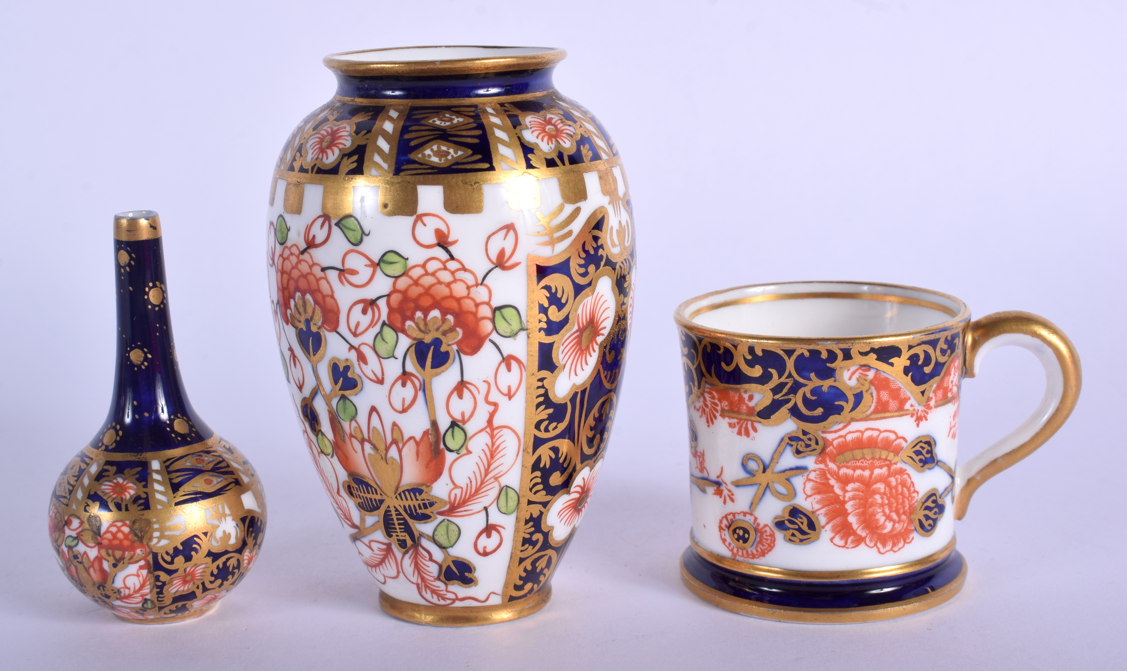 Royal Crown Derby imari pattern 6299 small vase, a bottle vase in the same pattern and a 26469 minia