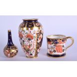 Royal Crown Derby imari pattern 6299 small vase, a bottle vase in the same pattern and a 26469 minia