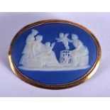 AN ANTIQUE YELLOW METAL WEDGWOOD BLUE JASPER WARE BROOCH. 20 grams. 5 cm x 2.75 cm.