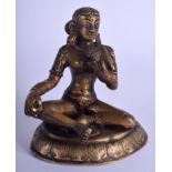 A 19TH CENTURY INDIAN BRONZE FIGURE OF A SEATED BUDDHISTIC DEITY modelled holding a bird upon a shap