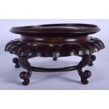 A LATE 19TH CENTURY CHINESE CARVED HARDWOOD STAND Late Qing, of open work scrolling form. 22 cm wide