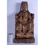 A LARGE EARLY CHINESE POLYCHROMED WOOD FIGURE OF A SEATED SCHOLAR Late Ming/Qing, modelled holding a