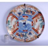 A VERY LARGE 19TH CENTURY JAPANESE MEIJI PERIOD IMARI CHARGER painted with boys within landscapes. 4