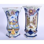 A PAIR OF 19TH CENTURY EUROPEAN DELFT FAIENCE VASES painted with figures and deer. 23 cm x 10 cm.
