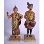 A PAIR OF MIDDLE EASTERN ANTIQUE INDIAN RAJASTHAN PAINTED WOOD FIGURES. 20 cm high.