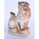 AN EARLY 20TH CENTURY INDIAN RAJASTHAN MARBLE FIGURE OF A LION modelled scowling. 8 cm x 12 cm.